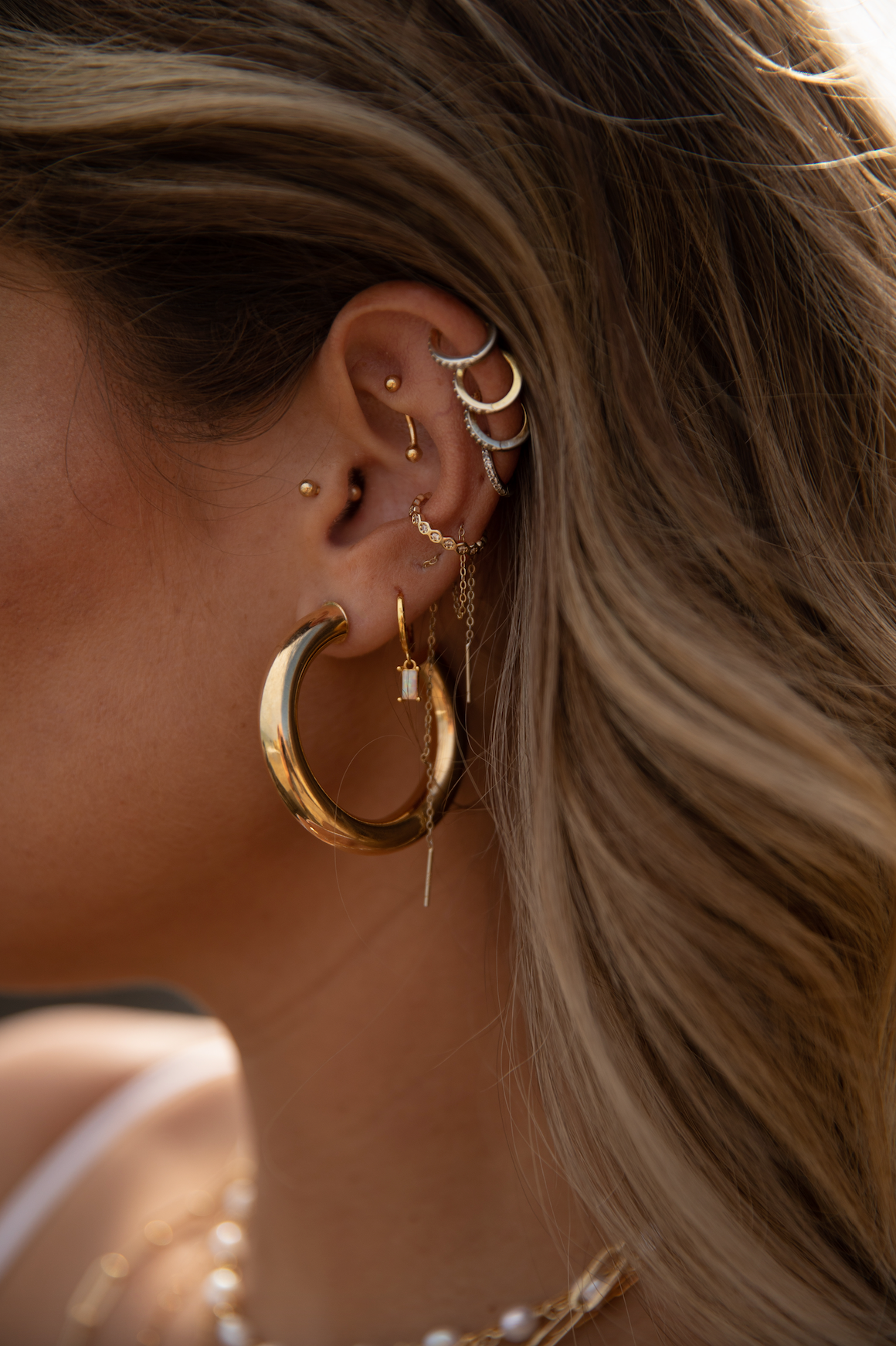 Thick thread wrapped open hoop earrings featuring faux leather snakeskin  details. Approximately 2